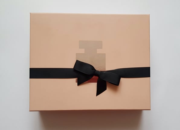 Beige Box with Perfume Bottle Symbol with Black Ribbon